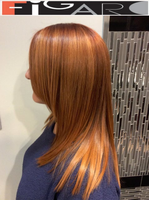 Ginger hair colored with honey caramel highlights. We use Olaplex L'oreal Goldwell